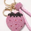 The pink strawberry-shaped keychain is a cute and girlish pendant that is small and portable Application Scenario
